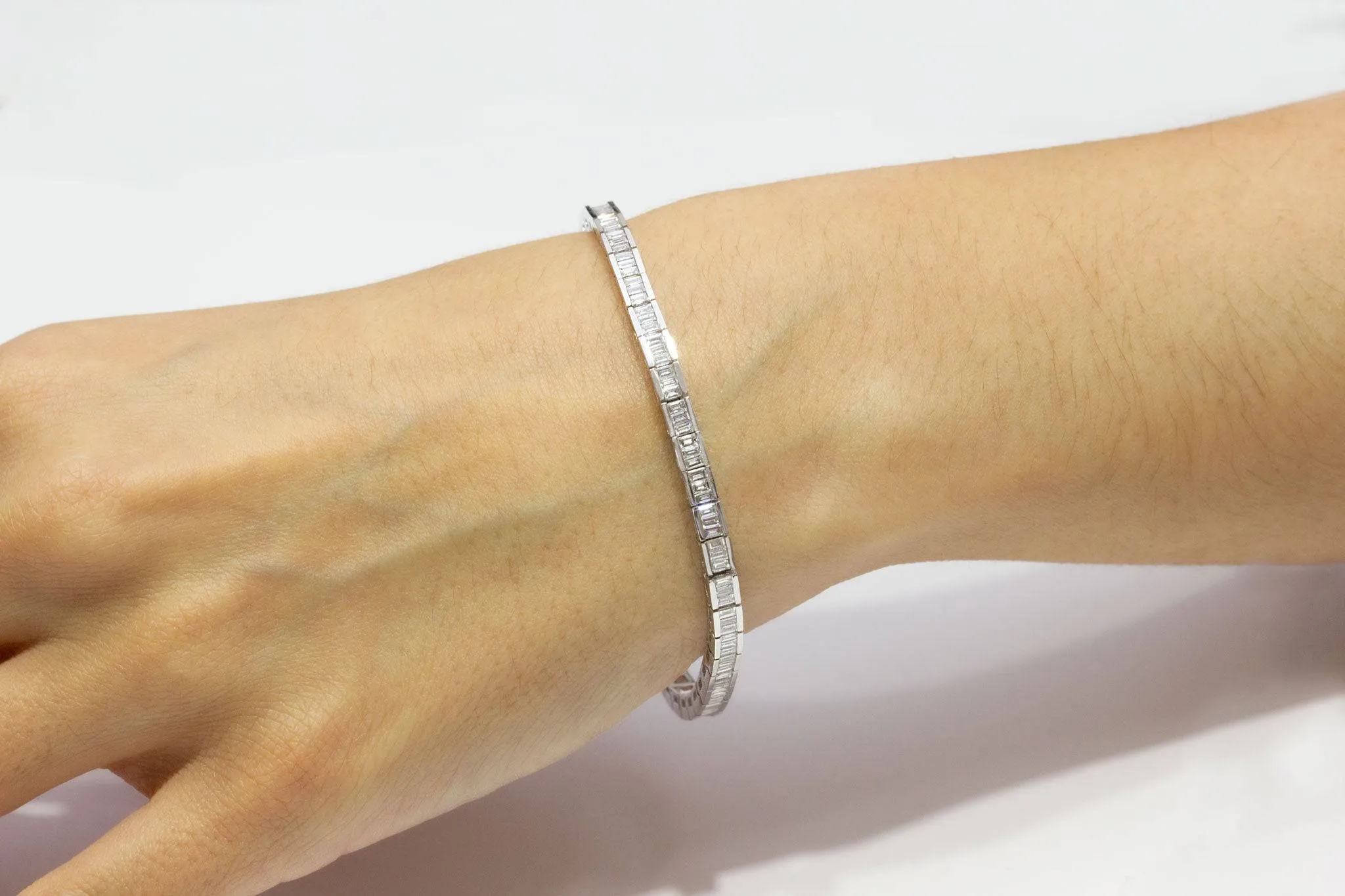 Baguette Cut Diamond Line Tennis Bracelet in Semi Bezel Setting.